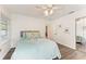 This bedroom boasts neutral walls, light gray headboard, and sliding mirrored closet at 160 Coolidge Dr, Sarasota, FL 34236