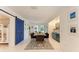 Bright dining room features stylish decor, modern furnishings, and a barn door at 160 Coolidge Dr, Sarasota, FL 34236
