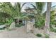 Charming two-story home with tropical landscaping and boulder accents at 160 Coolidge Dr, Sarasota, FL 34236