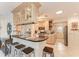 Well-lit kitchen with modern appliances, breakfast bar, and ample cabinet space for a delightful culinary experience at 160 Coolidge Dr, Sarasota, FL 34236