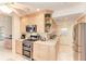 Well-equipped kitchen with stainless steel appliances, ample counter space, and storage solutions for organized cooking at 160 Coolidge Dr, Sarasota, FL 34236