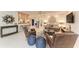 Bright living room with neutral tones, ceiling fan, and tile flooring provides a welcoming atmosphere at 160 Coolidge Dr, Sarasota, FL 34236