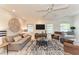 Bright living room with modern ceiling fan, stylish rug and comfortable furniture, creating a relaxing space at 160 Coolidge Dr, Sarasota, FL 34236