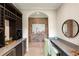Entertainer's bar area featuring a brick wall, ample counter space, and a wine rack at 16531 Kendleshire Ter, Lakewood Ranch, FL 34202