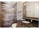 Well-appointed bathroom with a tiled shower, modern vanity, and stylish fixtures at 16531 Kendleshire Ter, Lakewood Ranch, FL 34202