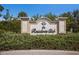 Elegant community sign for 'The Residents Club' surrounded by lush landscaping at 16531 Kendleshire Ter, Lakewood Ranch, FL 34202