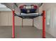 Spacious garage with car lift system, offering ample space for vehicle storage and maintenance at 16531 Kendleshire Ter, Lakewood Ranch, FL 34202