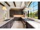Well-equipped kitchen featuring granite countertops, modern appliances, and a window with an outdoor view at 16531 Kendleshire Ter, Lakewood Ranch, FL 34202