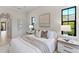 Light and airy main bedroom with neutral tones, two side tables, and a large bed at 16531 Kendleshire Ter, Lakewood Ranch, FL 34202