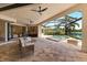 Enclosed patio features a pool, spa, outdoor kitchen, and comfortable seating for relaxation and entertaining at 16531 Kendleshire Ter, Lakewood Ranch, FL 34202