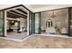 Inviting patio with dining and living areas, seamlessly connected to the home's interior through sliding glass doors at 16531 Kendleshire Ter, Lakewood Ranch, FL 34202