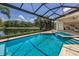 Enjoy poolside luxury with a spa and fire pit overlooking the serene lake and manicured landscaping at 16531 Kendleshire Ter, Lakewood Ranch, FL 34202