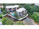 Stunning aerial view of waterfront condo community with a pool and lush landscaping at 1740 Alderman St # 7, Sarasota, FL 34236