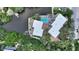 Aerial view of property featuring a community pool, private docks, and lush green surroundings at 1740 Alderman St # 7, Sarasota, FL 34236