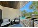Cozy outdoor balcony provides a relaxing spot to unwind with serene views of the pool at 1740 Alderman St # 7, Sarasota, FL 34236
