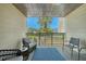Relax on this covered balcony with comfortable seating and peaceful views of the water at 1740 Alderman St # 7, Sarasota, FL 34236