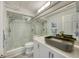 Modern bathroom featuring a glass shower, a unique vessel sink, and elegant fixtures at 1740 Alderman St # 7, Sarasota, FL 34236