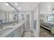This bathroom includes double sinks and a shower room at 1740 Alderman St # 7, Sarasota, FL 34236