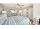 This bedroom features a large mirror, fan and closet with ample storage space at 1740 Alderman St # 7, Sarasota, FL 34236