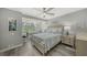 Bright bedroom featuring wood floors, a desk, and a large window at 1740 Alderman St # 7, Sarasota, FL 34236