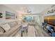 The home's coastal design complements the open-concept living and dining space with bright colors and views of the kitchen at 1740 Alderman St # 7, Sarasota, FL 34236