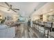 Open-concept living space with bar and entertainment area with views to the outside at 1740 Alderman St # 7, Sarasota, FL 34236