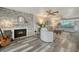 The living room area features a fireplace, decor and open access to the kitchen and bar at 1740 Alderman St # 7, Sarasota, FL 34236