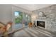 Cozy living room area with fireplace and sliding doors to the outdoor balcony at 1740 Alderman St # 7, Sarasota, FL 34236