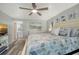 This bedroom features wood floors, coastal decor, and access to the en-suite bathroom at 1740 Alderman St # 7, Sarasota, FL 34236