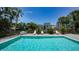 Inviting swimming pool area with lounge chairs and palm trees, perfect for relaxation at 1740 Alderman St # 7, Sarasota, FL 34236