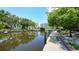 Peaceful waterfront with well-manicured landscaping creating a serene atmosphere and picturesque setting at 1740 Alderman St # 7, Sarasota, FL 34236