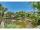 Scenic waterfront view of private docks surrounded by tropical foliage and calm waters at 1740 Alderman St # 7, Sarasota, FL 34236