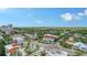Expansive aerial view showcasing the city's architecture, lush greenery, and street layout on a sunny day at 1771 Ringling Blvd # 1206, Sarasota, FL 34236