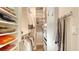 Organized walk-in closet with ample shelving and hanging space for clothes, shoes, and accessories at 1771 Ringling Blvd # 1206, Sarasota, FL 34236