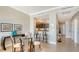 Dining area featuring neutral tones, modern lighting, and easy access to the kitchen and entryway at 1771 Ringling Blvd # 1206, Sarasota, FL 34236