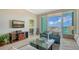 Bright living room featuring tile flooring, comfortable seating and a balcony with gorgeous water views at 1771 Ringling Blvd # 1206, Sarasota, FL 34236