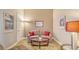 Cozy living room featuring a comfortable sofa, round table, and stylish décor creating an inviting atmosphere at 1771 Ringling Blvd # 1206, Sarasota, FL 34236