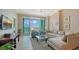 Comfortable living room featuring neutral tones, tile flooring and large windows to enjoy a gorgeous view at 1771 Ringling Blvd # 1206, Sarasota, FL 34236