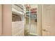 Organized walk-in closet featuring built-in shelves and drawers for optimal storage solutions at 1771 Ringling Blvd # 1206, Sarasota, FL 34236