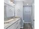 Bright bathroom with double sinks, granite counters, and updated fixtures plus walk-in shower at 19185 Sherbrooke Ave, Port Charlotte, FL 33954