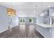 Bright living room featuring recessed lighting, gray flooring, and glass doors leading to the outdoors at 19185 Sherbrooke Ave, Port Charlotte, FL 33954