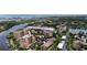 Stunning aerial view of the community with lush landscaping and bay views at 1921 Monte Carlo Dr # 302, Sarasota, FL 34231