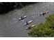 Aerial view of people kayaking on the water near green trees at 1921 Monte Carlo Dr # 302, Sarasota, FL 34231