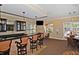Elegant bar area with counter seating, sleek countertops, and a flatscreen TV, great for entertaining guests and relaxation at 1921 Monte Carlo Dr # 302, Sarasota, FL 34231