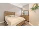 Cozy bedroom features neutral decor, a dresser, and a serene ambiance for relaxation at 1921 Monte Carlo Dr # 302, Sarasota, FL 34231