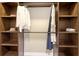 Organized walk-in closet with built-in shelves and hanging rods at 1921 Monte Carlo Dr # 302, Sarasota, FL 34231