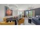 Stylish dining area with modern lighting, balcony access, and elegant furniture at 1921 Monte Carlo Dr # 302, Sarasota, FL 34231