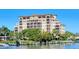 Waterfront condo building with multiple balconies offering stunning views and dock access at 1921 Monte Carlo Dr # 302, Sarasota, FL 34231