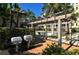 Outdoor grilling area with barbecue grills, and lounge chairs, perfect for community gatherings and summer barbecues at 1921 Monte Carlo Dr # 302, Sarasota, FL 34231