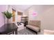 Inviting living area featuring cozy seating, decorative rug, and a bar area with a neon sign at 1921 Monte Carlo Dr # 302, Sarasota, FL 34231